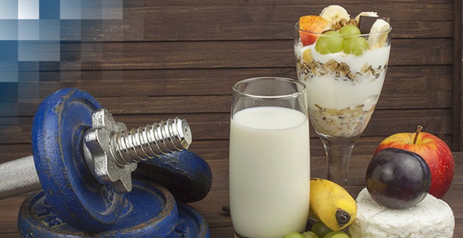 Healthy football nutrition foods including milk, fruits, vegetables and protein sources for athletic performance