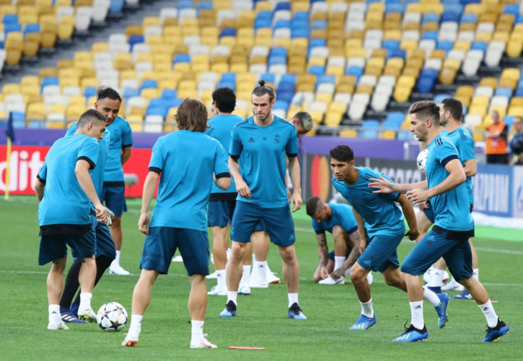Professional football teams Real Madrid, Liverpool Manchester City performing rondo training drills for elite Toronto football coaching inspiration